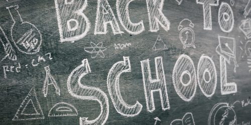 Freehand drawing Back to school on chalkboard